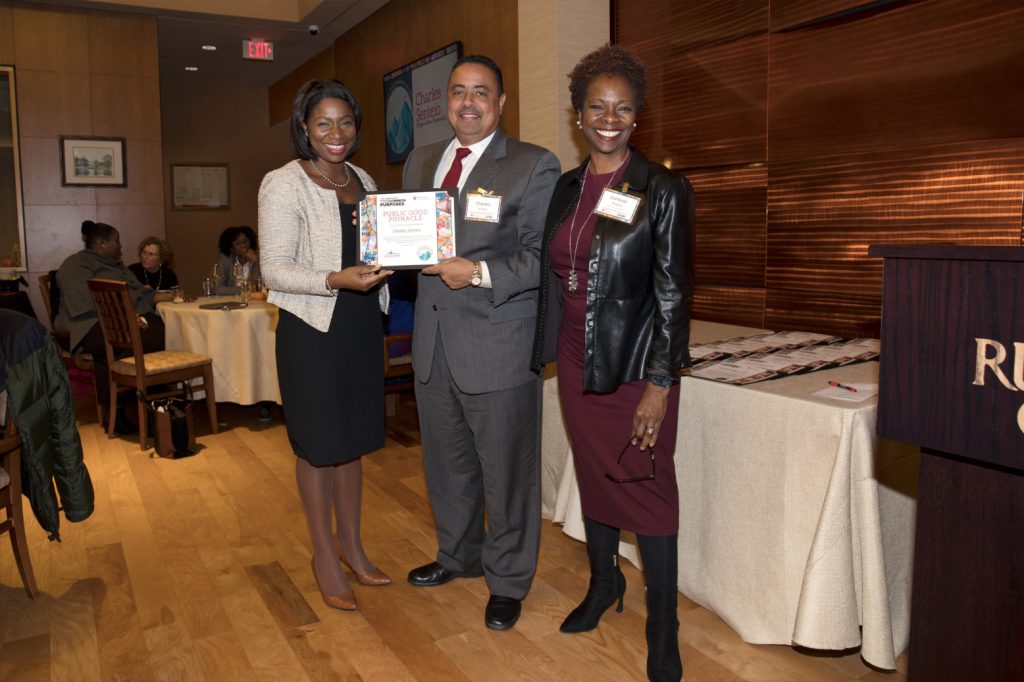 Charles Senteio (center), associate professor of library and information science, with Anna Branch (left) and Corlisse Thomas (right), a member of the Committee to Advance Our Common Purposes, received the Public Good Pinnacle Award.
Mel Evans