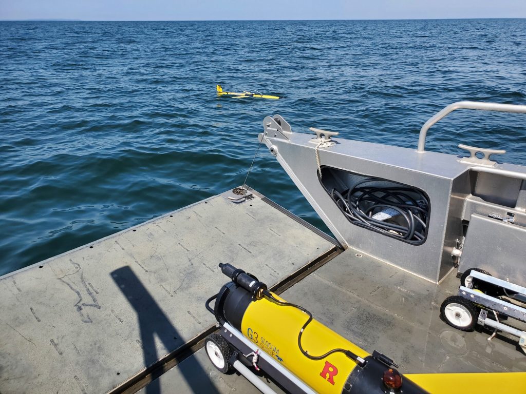 Two Rutgers underwater robots called gliders being deployed in April 2023 to observe water quality along the New Jersey coastal shelf. Gliders move up and down through the water column, taking measurements every 2 seconds, and can travel up to 20 kilometers (12.5 miles) per day. Photo credit: Chip Haldeman, Rutgers University.