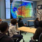 Marine scientist Nicole Waite of the Rutgers Center for Ocean Observing Leadership (RU COOL) explains to high school students from the Rutgers 4-H STEM Ambassadors program how ocean waters yield insights into climate change. The program connects students with Waite and other working researchers. Jennie Thomas/4-H Youth Development