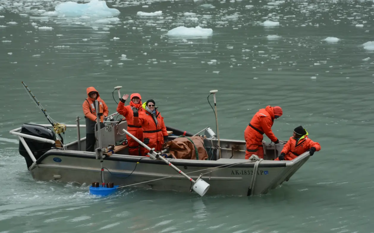 Setting out on the small boat for surveying. 