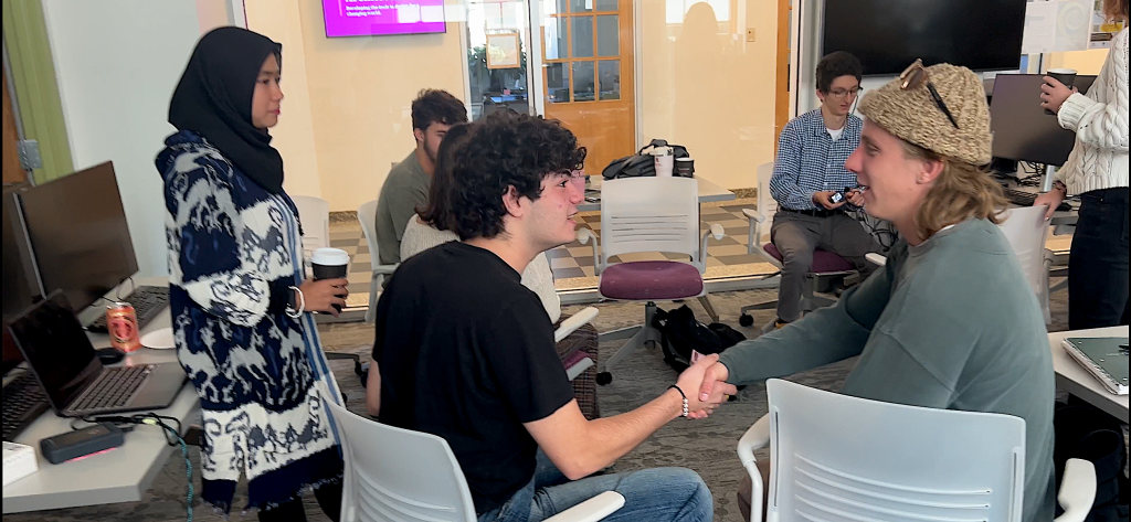 Ecology students Colby Koutrakos and Shaniya Utami meet with SUNY ESF students.