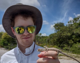 Myself holding a bush anole (Polychrus acutirostris), a rare species found in the same restinga habitat as Ameivula ocellifera. We caught our Ameivula only a few yards from where we found this lizard.