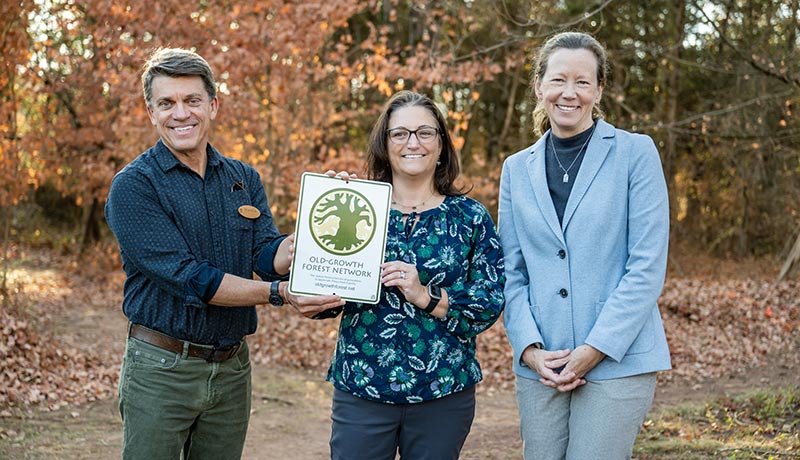 Representatives from Rutgers and the Old-Growth Forest Network celebrate the induction of Mettler's Woods into the network: (From Left) Brian Kane, Mid-Atlantic Manager of the network; Myla Aronson, Assistant Professor, Department of Ecology, Evolution and Natural Resources; and Laura Lawson, Executive Dean, School of Environmental and Biological Sciences.