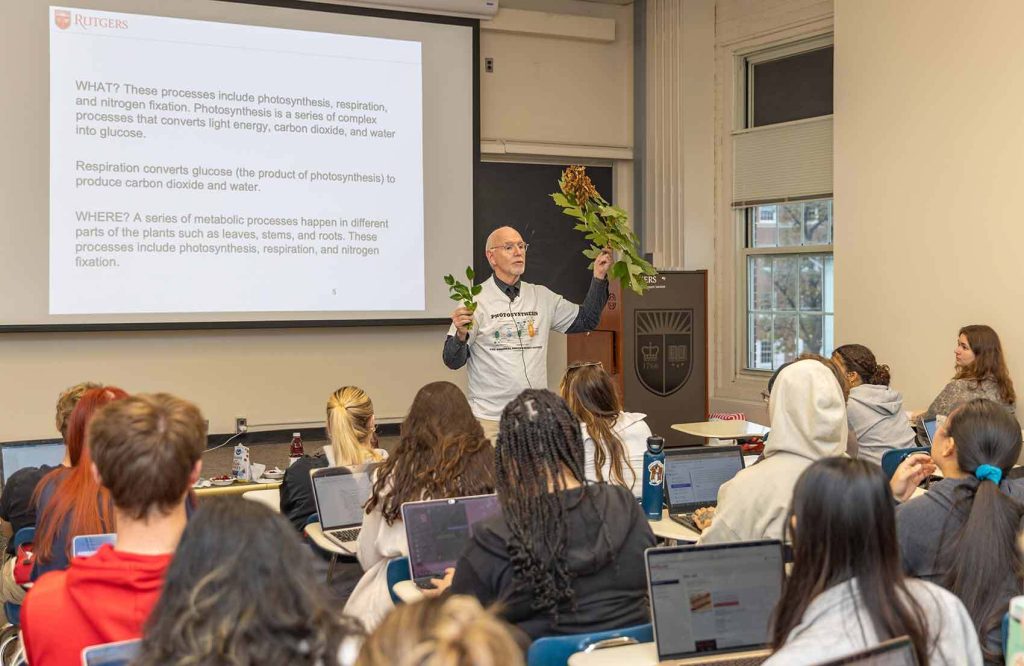 Mark Robson, a toxicologist, often uses props when explaining plant processes such as photosynthesis, including branches of swamp white oak and Douglas Fir.