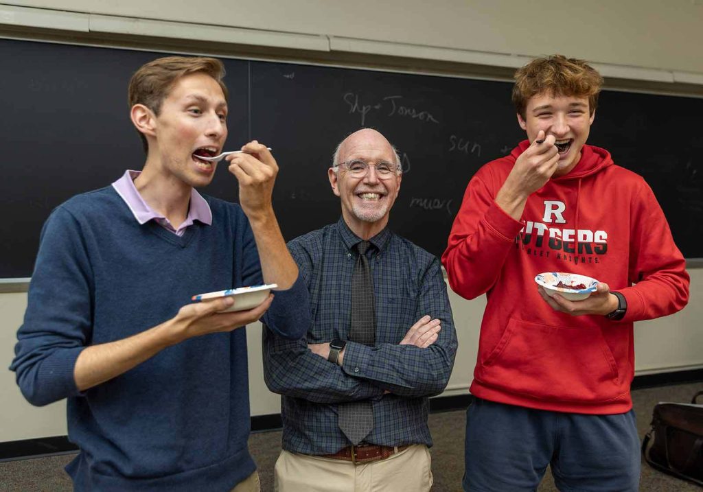 Science can be a serious subject, but it also can be fun, says Distinguished Professor Mark Robson (center.) On "Cranberry Night" in Robson's evening plant science class, senior Connor Morrissey (left) and sophomore Jonas Covalesky (right) sample the tart fruit.