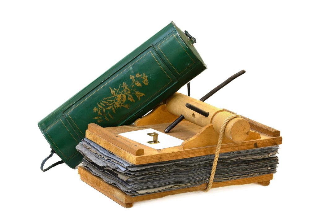 Field collecting tools of the type that Hilma af Klint might have used in the 1800s – a wooden herbarium plant press, a brass magnifier, and a vasculum, a metal transport box for transporting collected live plants. Photo credit: Susanne Ruemmele, 2024.