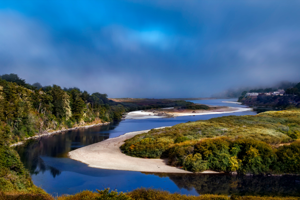 The Gualala River meets Pacific Ocean Mendocino California on a partly cloudy day