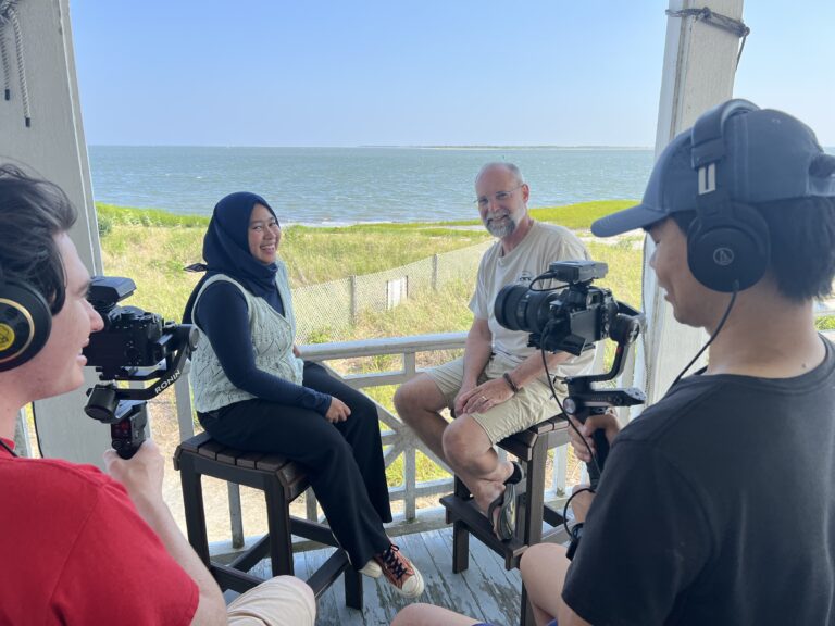 Shaniya Utamidata filming an interview