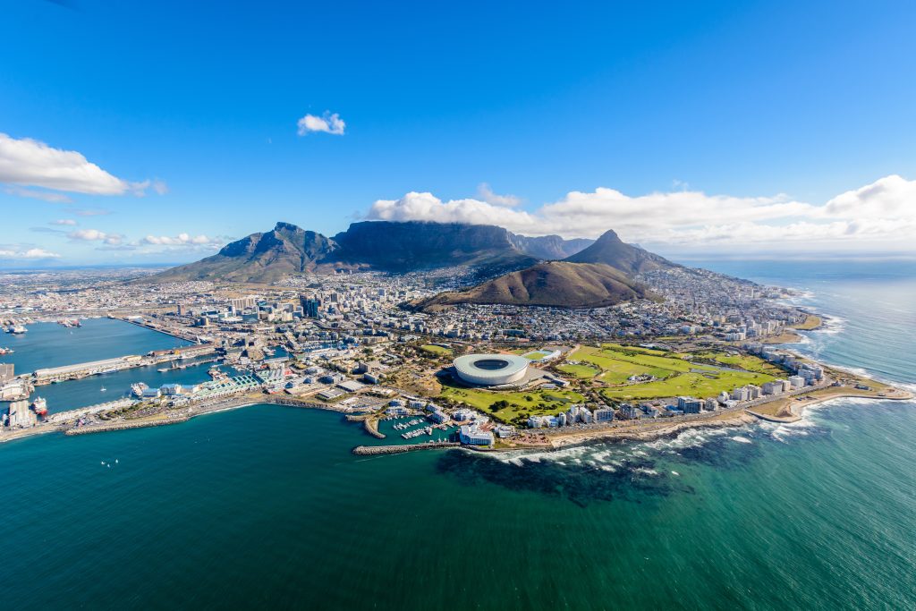Aerial view of Cape Town, South Africa during daytime, depicting the cityscape and shore