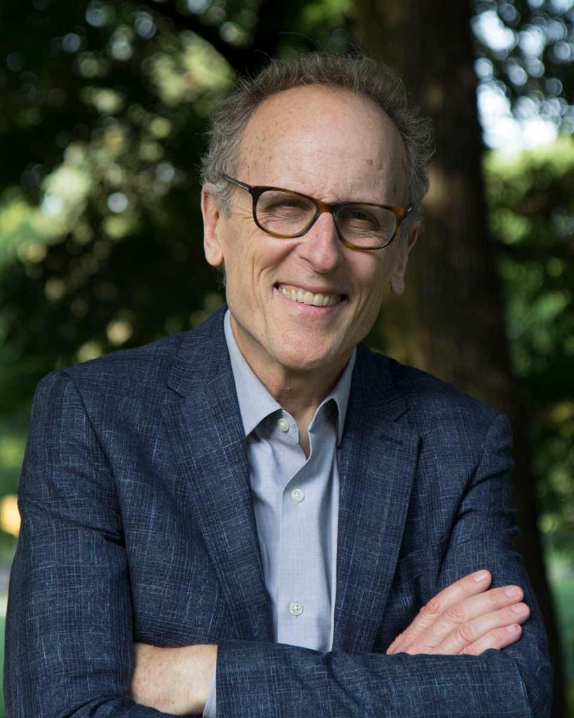 Photo of Thomas F. Lennon smiling and crossing his arms