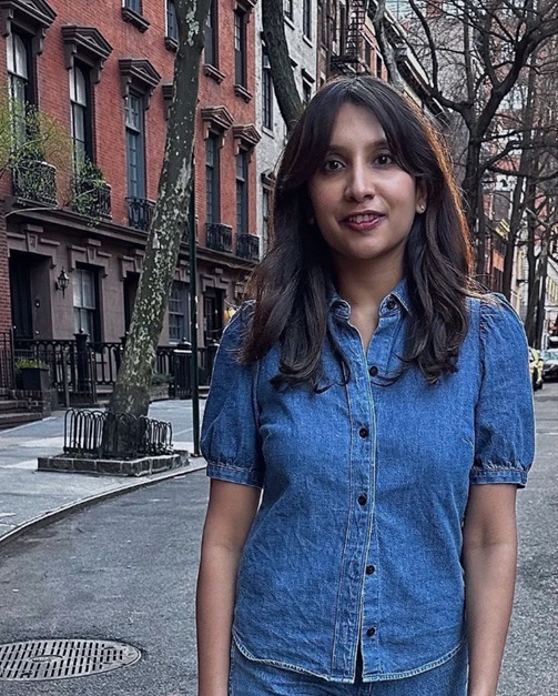 Photo of Manasa Bollempalli standing in the street.