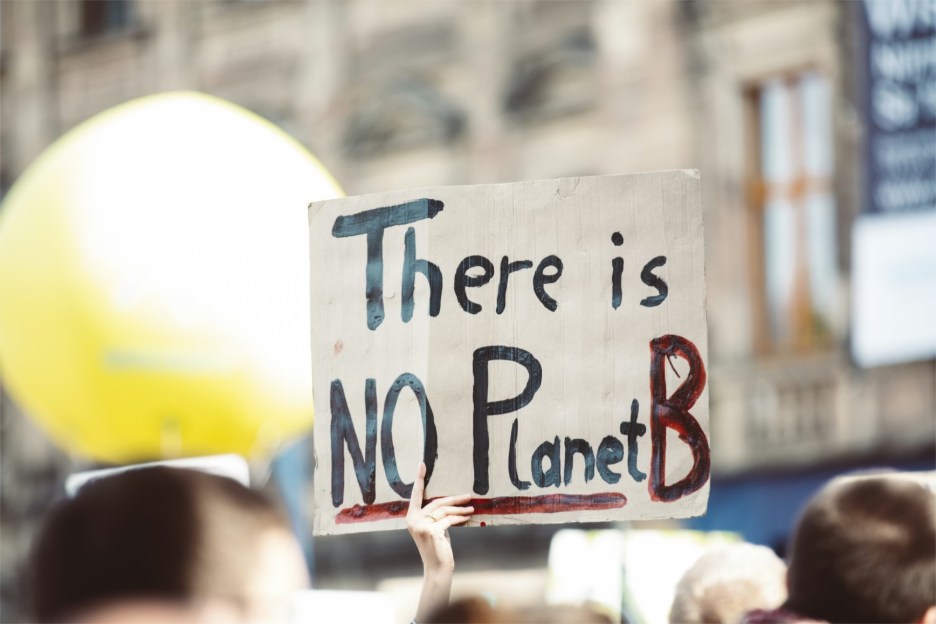 Close up of a hand painted poster at a climate protest that reads "There is no Plant B."