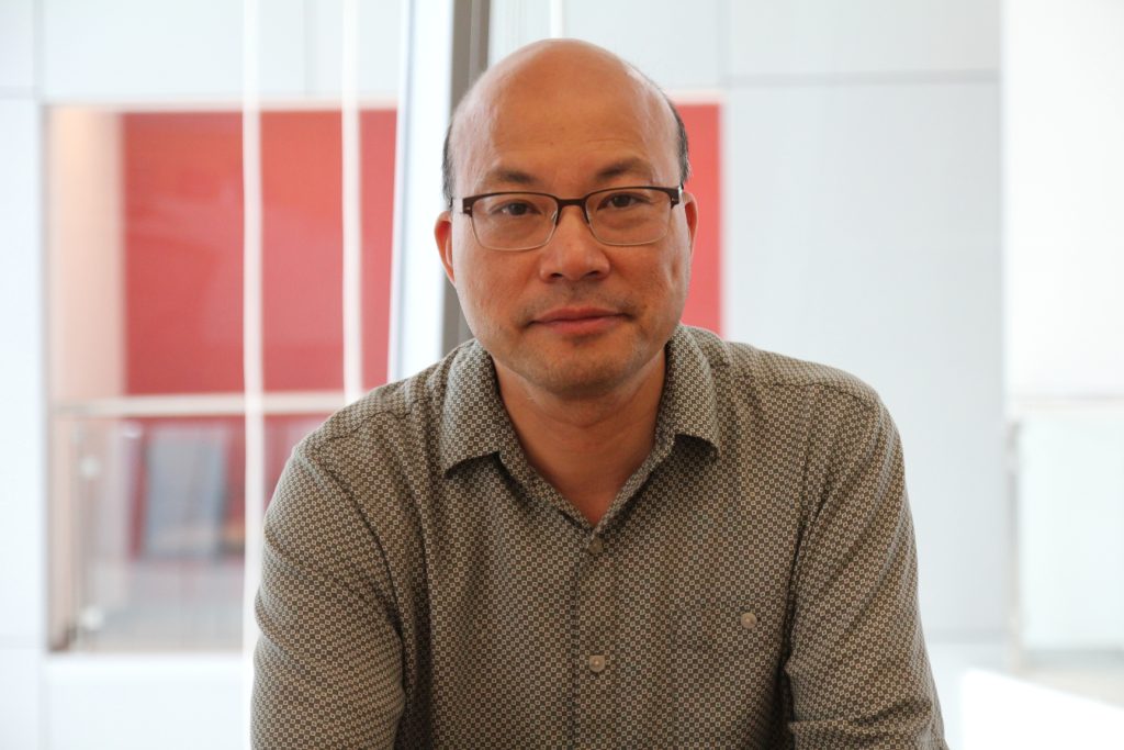 Photo of Qizhong (George) Guo from the bust up