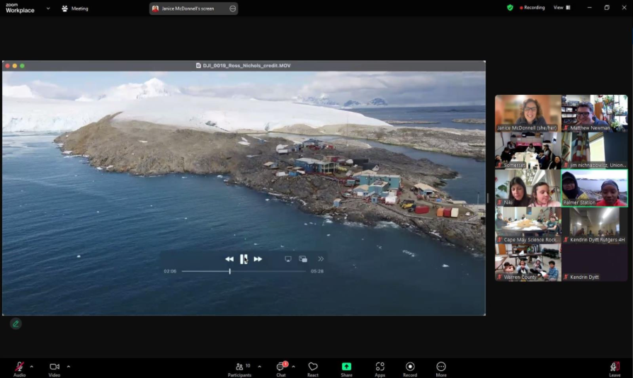 Screenshot of a Zoom with group of participants' screens on the right and a shared screen playing a video on the left