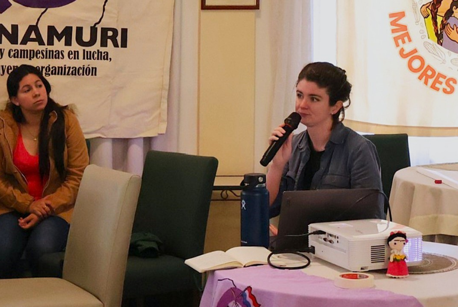 Jamie Gagliano giving a presentation at a workshop for Paraguayan organization Conamuri during one of their meetings focused on environmental rights and women.